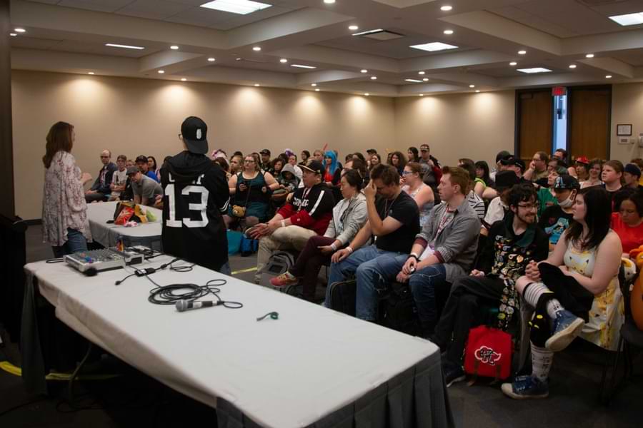 2026 21 Two panelists stand in front of a room full of people